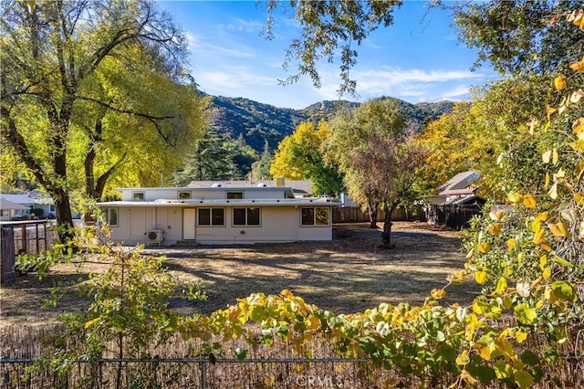 rear view of property with a mountain view