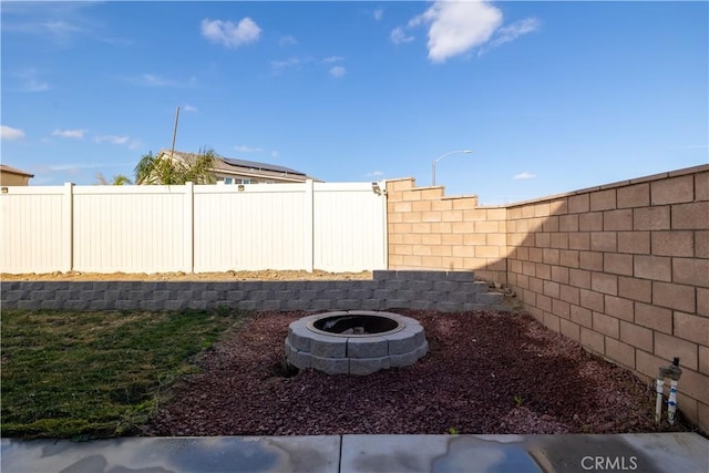 view of yard with an outdoor fire pit