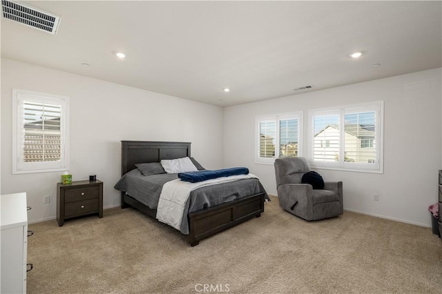 bedroom with light carpet