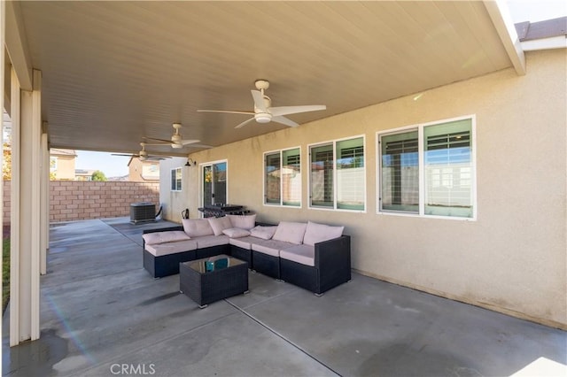 view of patio featuring central AC unit, ceiling fan, and an outdoor hangout area