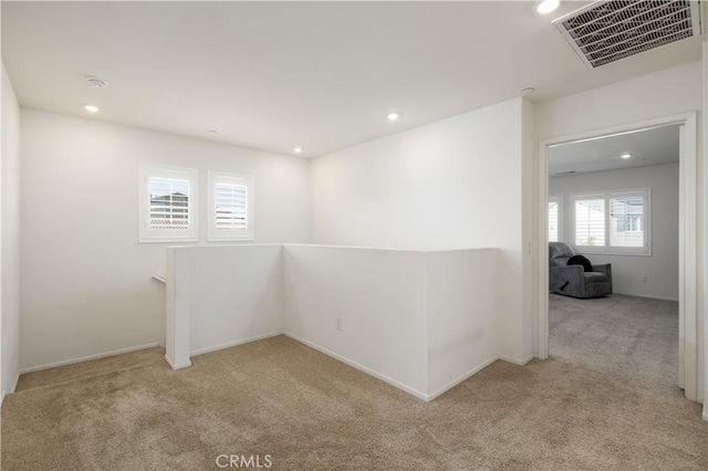 empty room with light colored carpet