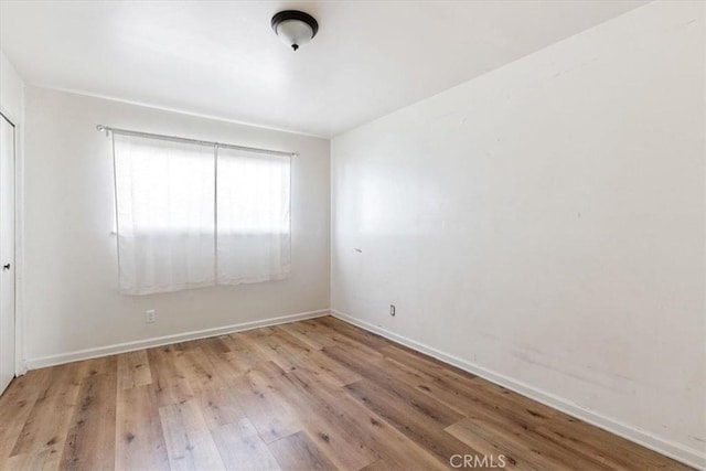 unfurnished room featuring light hardwood / wood-style flooring