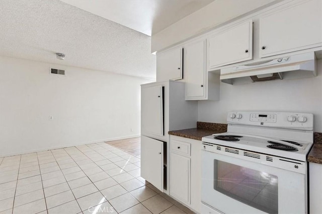 kitchen featuring white cabinets, white electric range, and a textured ceiling