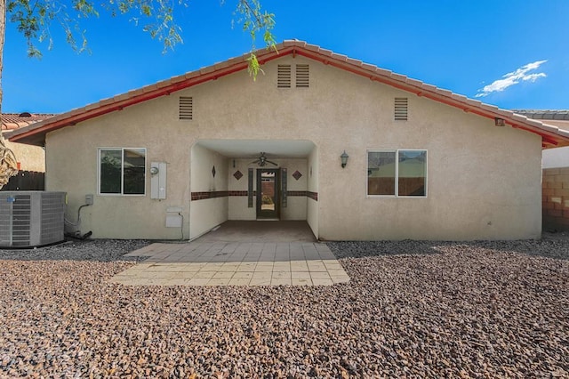 rear view of property featuring central air condition unit, a patio area, and ceiling fan