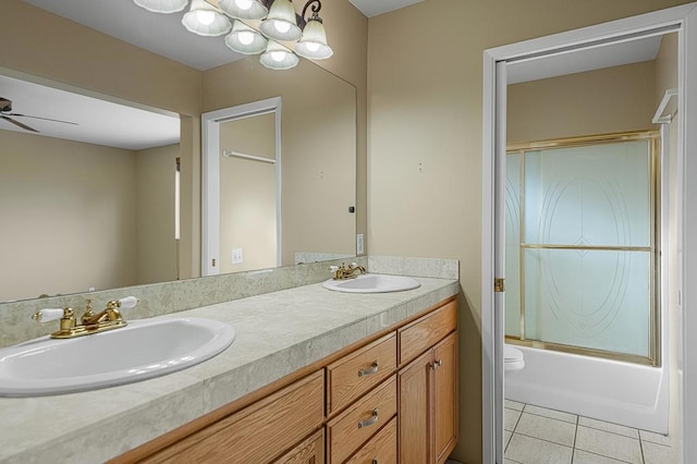 bathroom featuring shower / bath combination with glass door, vanity, tile patterned floors, and ceiling fan