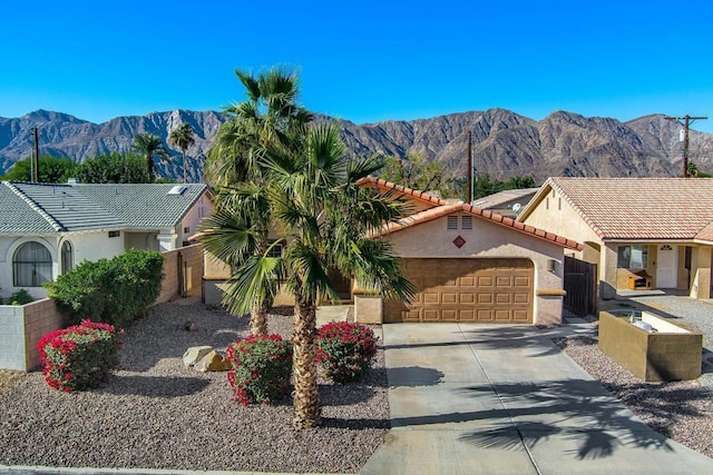 view of front of home featuring a mountain view and a garage