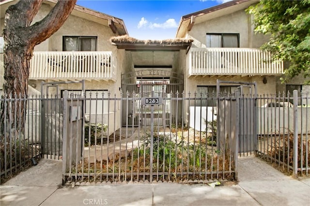 view of front of house featuring a balcony