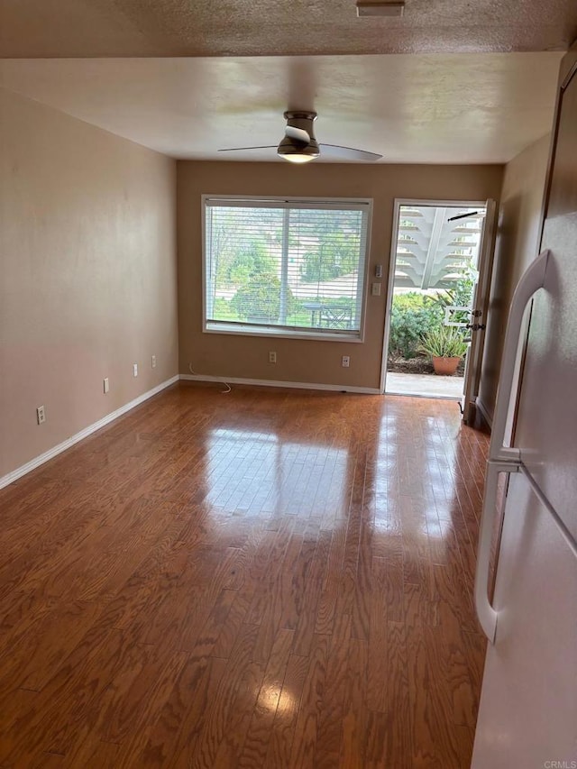 unfurnished room with light hardwood / wood-style flooring and ceiling fan