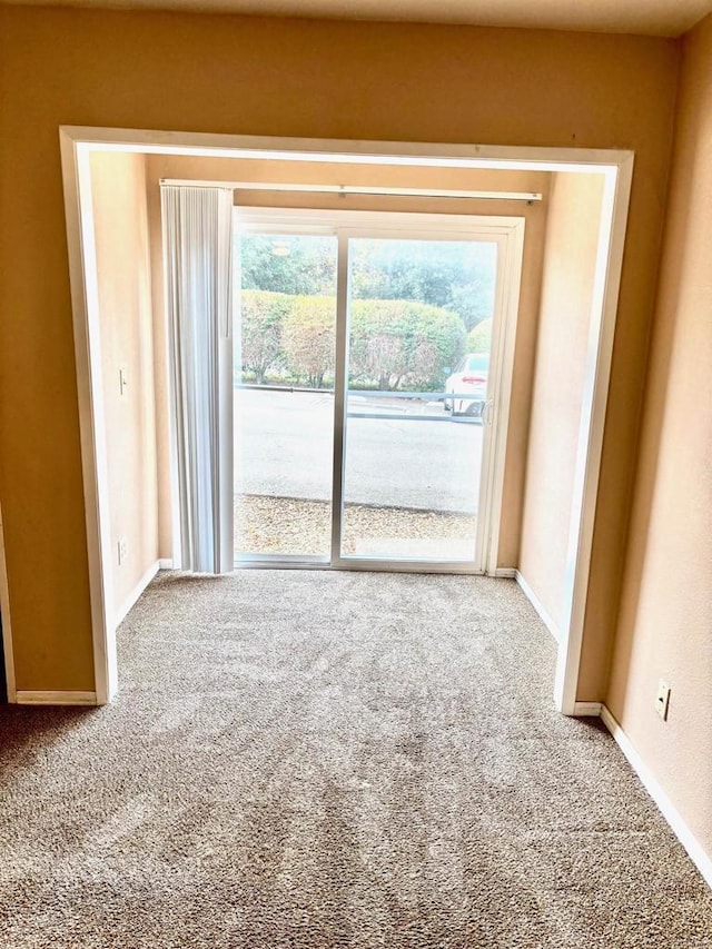 unfurnished living room with carpet flooring