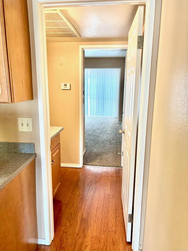 hallway featuring light hardwood / wood-style flooring