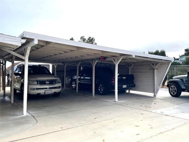 view of vehicle parking featuring a carport