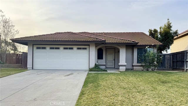 view of front of home featuring a garage and a front lawn