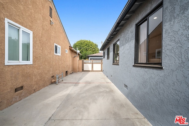 view of side of property with a patio area