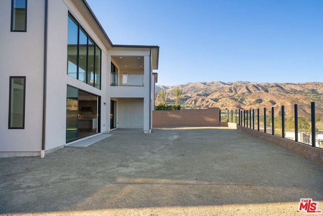 view of patio / terrace featuring a mountain view