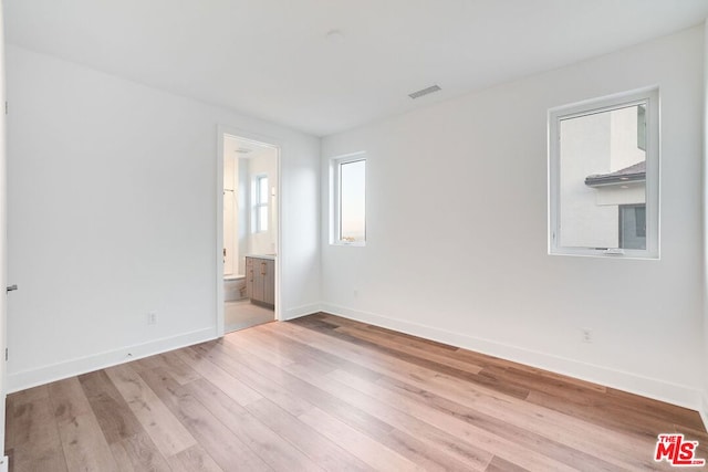 empty room with light wood-type flooring