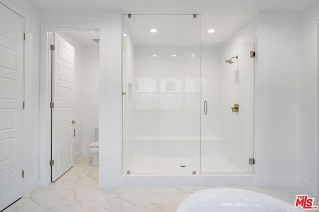 bathroom with toilet and separate shower and tub