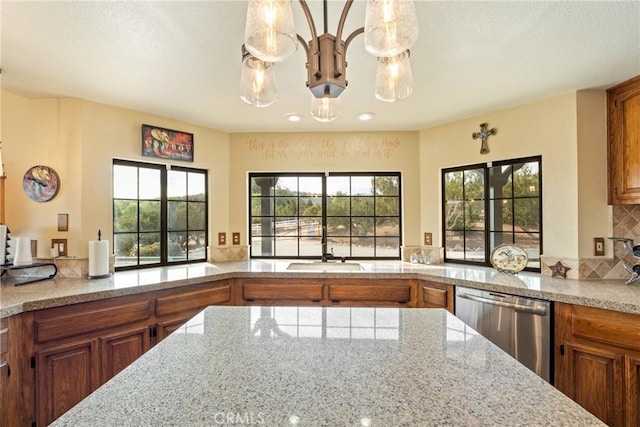 6535 Juniper Crest Rd, Agua Dulce, CA 91390 - kitchen featuring dishwasher, brown cabinets, a chandelier, and light stone countertops