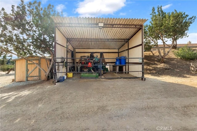 view of outbuilding with a carport