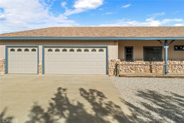 6535 Juniper Crest Rd, Agua Dulce, CA 91390 - ranch-style home with driveway, a shingled roof, a garage, and stone siding