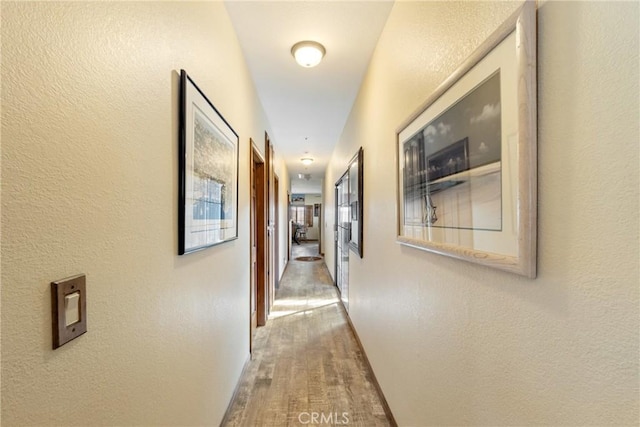 6535 Juniper Crest Rd, Agua Dulce, CA 91390 - hall featuring a textured wall and wood finished floors