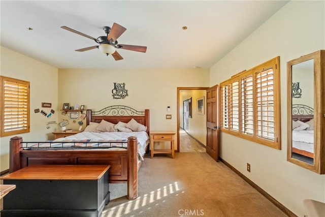 bedroom featuring ceiling fan and light colored carpet