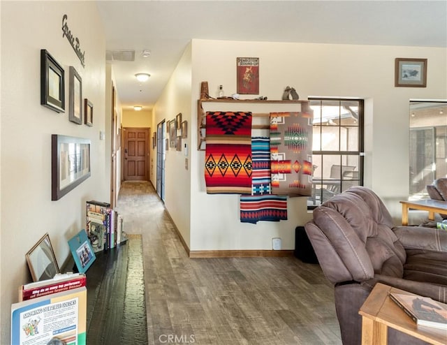 living room featuring a healthy amount of sunlight and hardwood / wood-style flooring