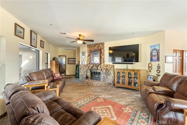 6535 Juniper Crest Rd, Agua Dulce, CA 91390 - living area featuring wood finished floors, a ceiling fan, and a fireplace