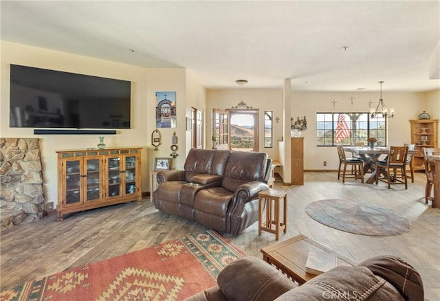 living room featuring a chandelier and hardwood / wood-style flooring