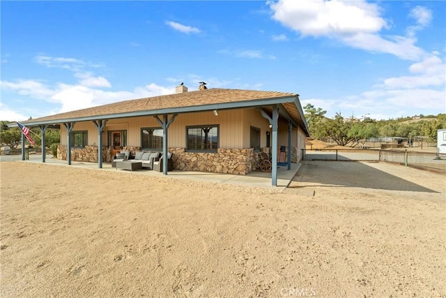 6535 Juniper Crest Rd, Agua Dulce, CA 91390 - back of house featuring an outdoor hangout area, stone siding, a chimney, and a patio area