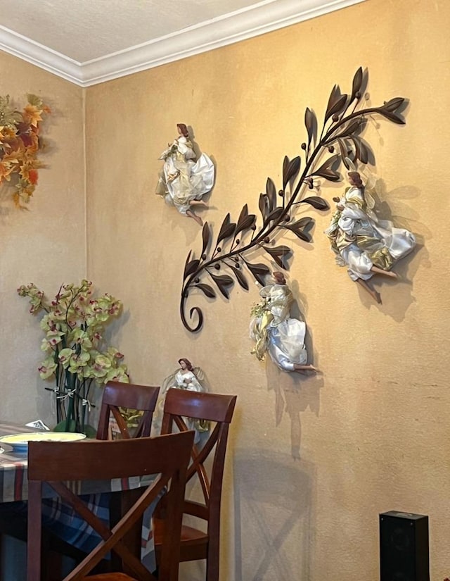 dining room featuring crown molding