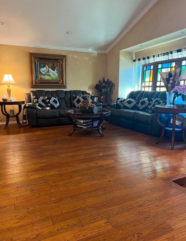 living room with crown molding, lofted ceiling, and wood-type flooring