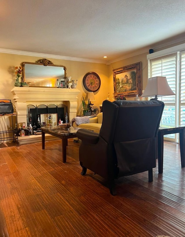 living room featuring hardwood / wood-style flooring and ornamental molding