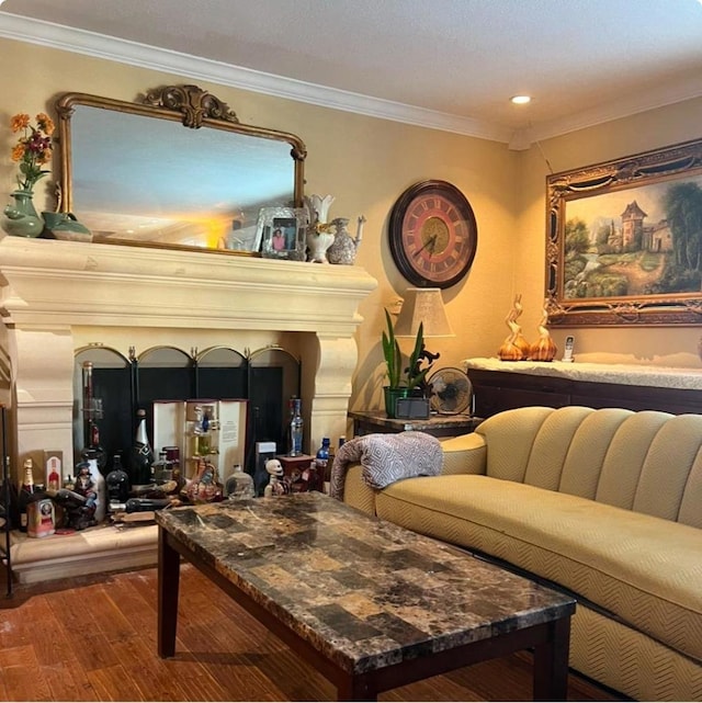 interior space with ornamental molding, hardwood / wood-style floors, and bar area