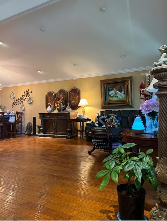 misc room with wood-type flooring and ornamental molding