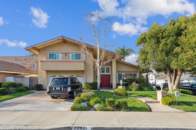 view of front of property with a garage and a front lawn