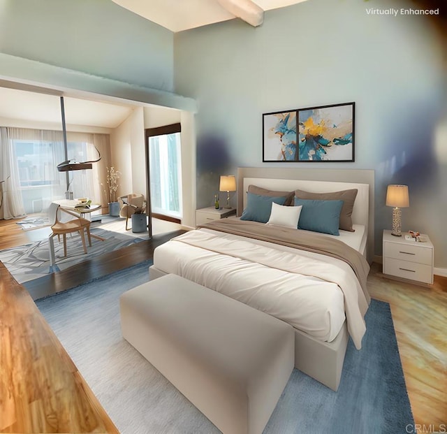 bedroom with beamed ceiling and wood-type flooring