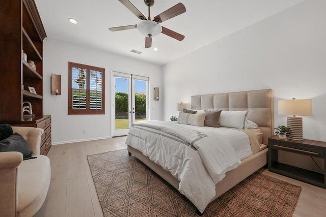 bedroom with access to outside, ceiling fan, and wood-type flooring