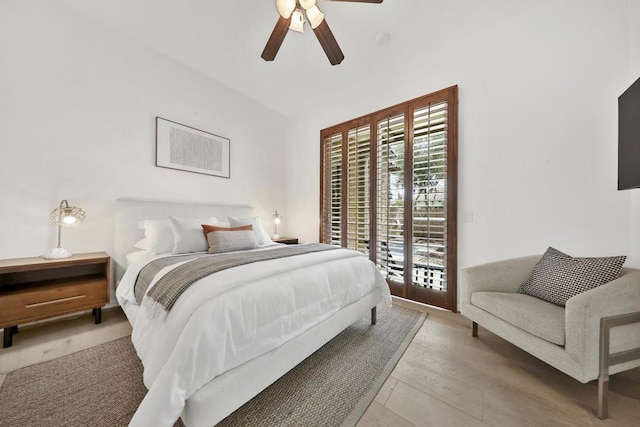 bedroom with ceiling fan, lofted ceiling, access to outside, and light hardwood / wood-style flooring