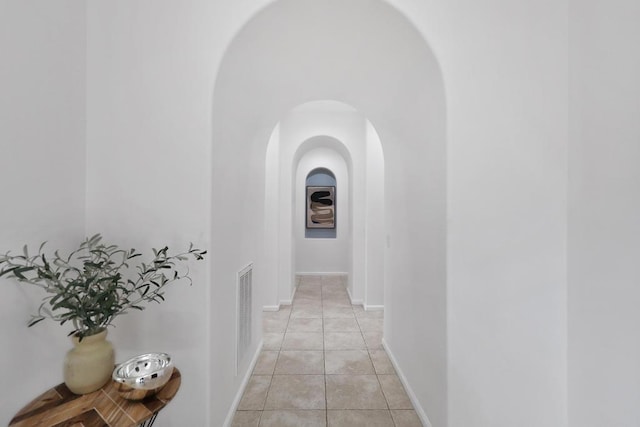 hallway featuring light tile patterned floors