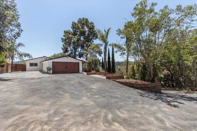 view of side of property featuring a garage