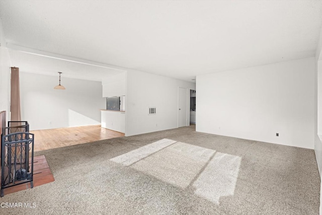 unfurnished room featuring carpet