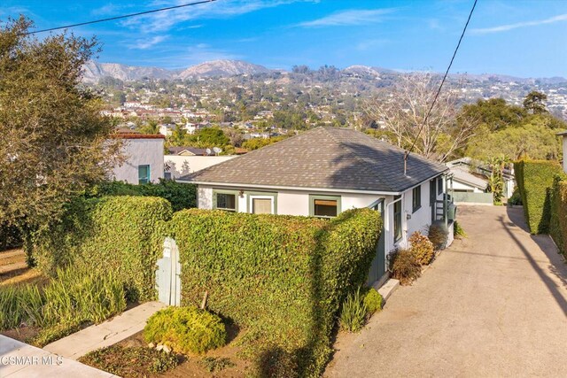 view of side of property with a mountain view