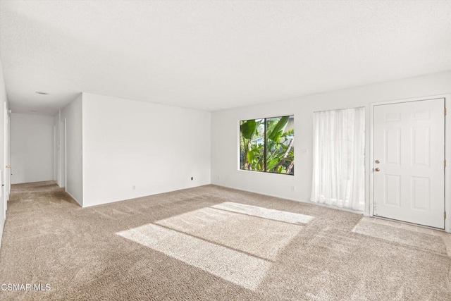 spare room featuring carpet flooring