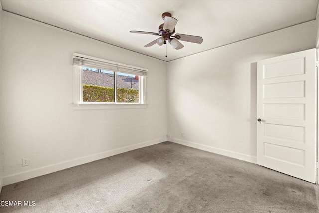 empty room with ceiling fan and carpet flooring