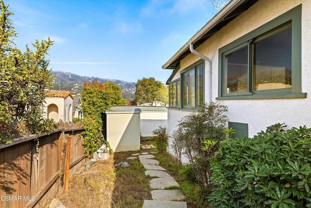 view of home's exterior with a mountain view