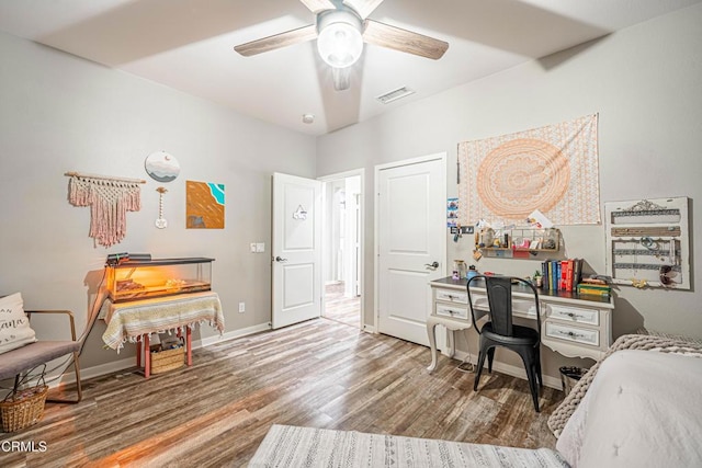 bedroom with hardwood / wood-style flooring and ceiling fan