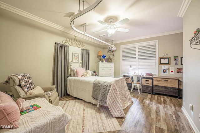 bedroom with crown molding, ceiling fan, and hardwood / wood-style floors