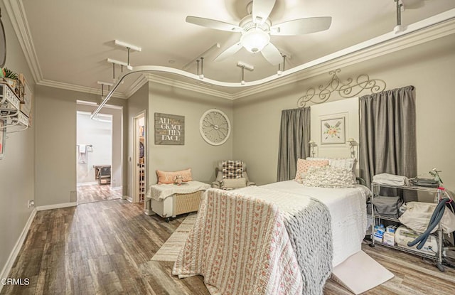 bedroom featuring crown molding, ceiling fan, and wood-type flooring