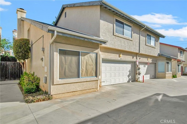 view of side of home featuring a garage