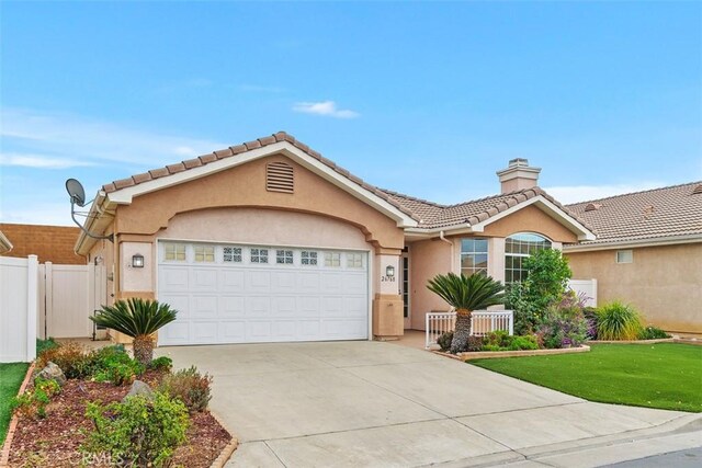 single story home featuring a front yard and a garage